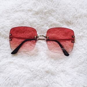 Laurel Clear Orange Rimless Sleek Sunglasses